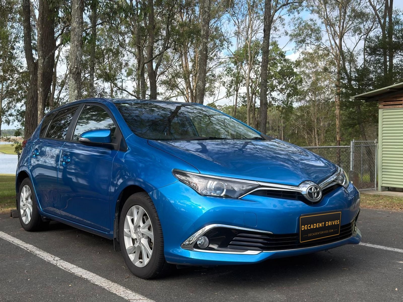 Blue 2018 Toyota Corolla hatchback, front three-quarter view – Decadent Drives hire car, Brisbane